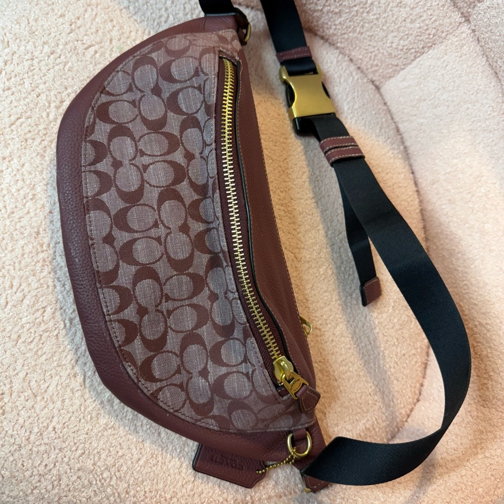Coach Brown Crossbody Bag with Monogram Pattern and Gold Accents